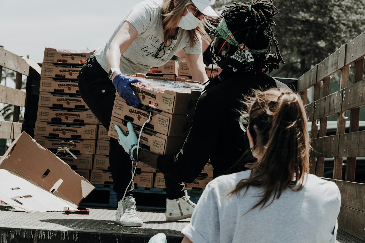 Volunteers packing food for fair distribution